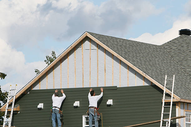 Professional Storm Damage Siding Repair technician working in Irving, TX